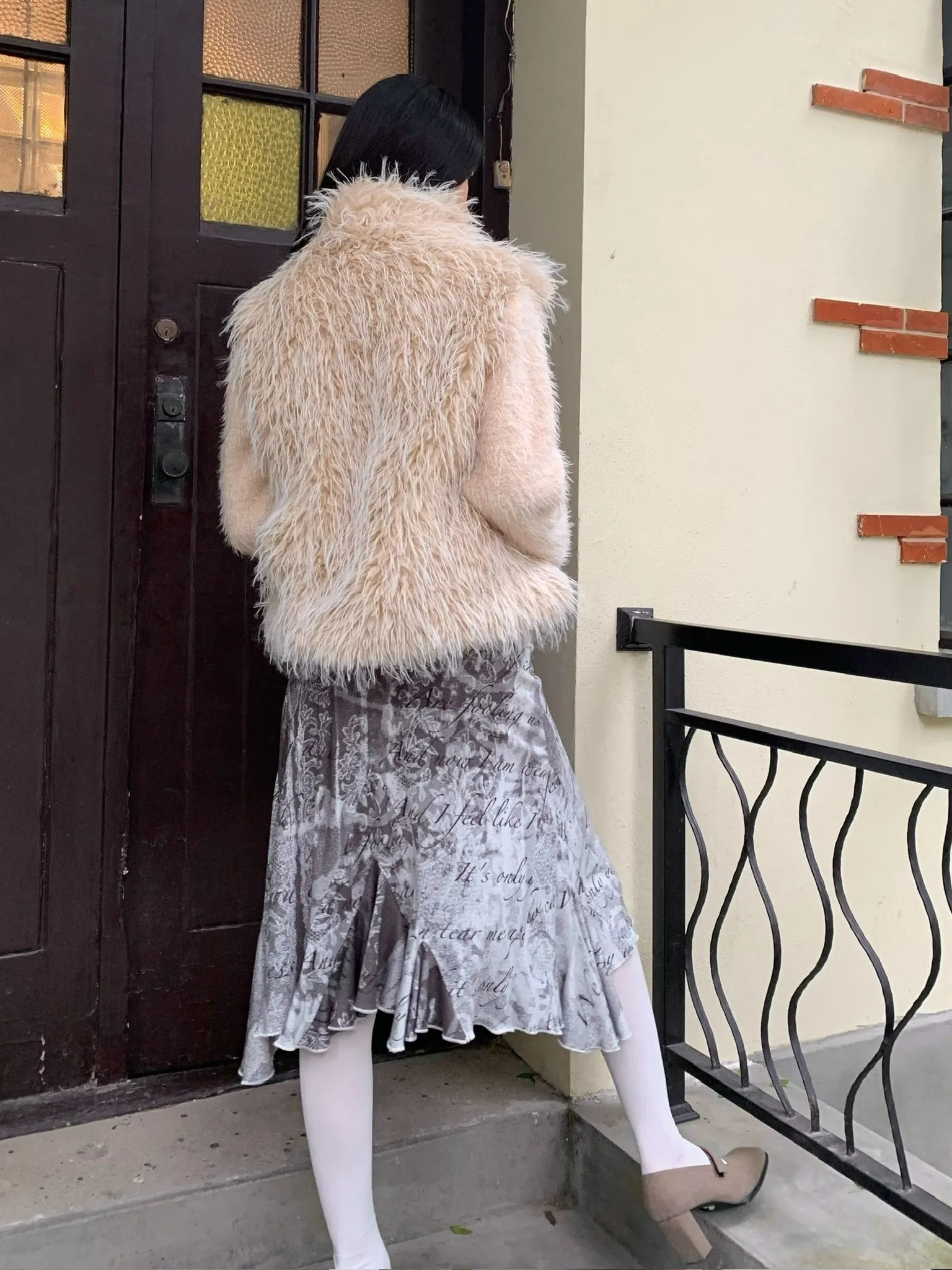 Beige warm faux fur coat with thick knit sleeves